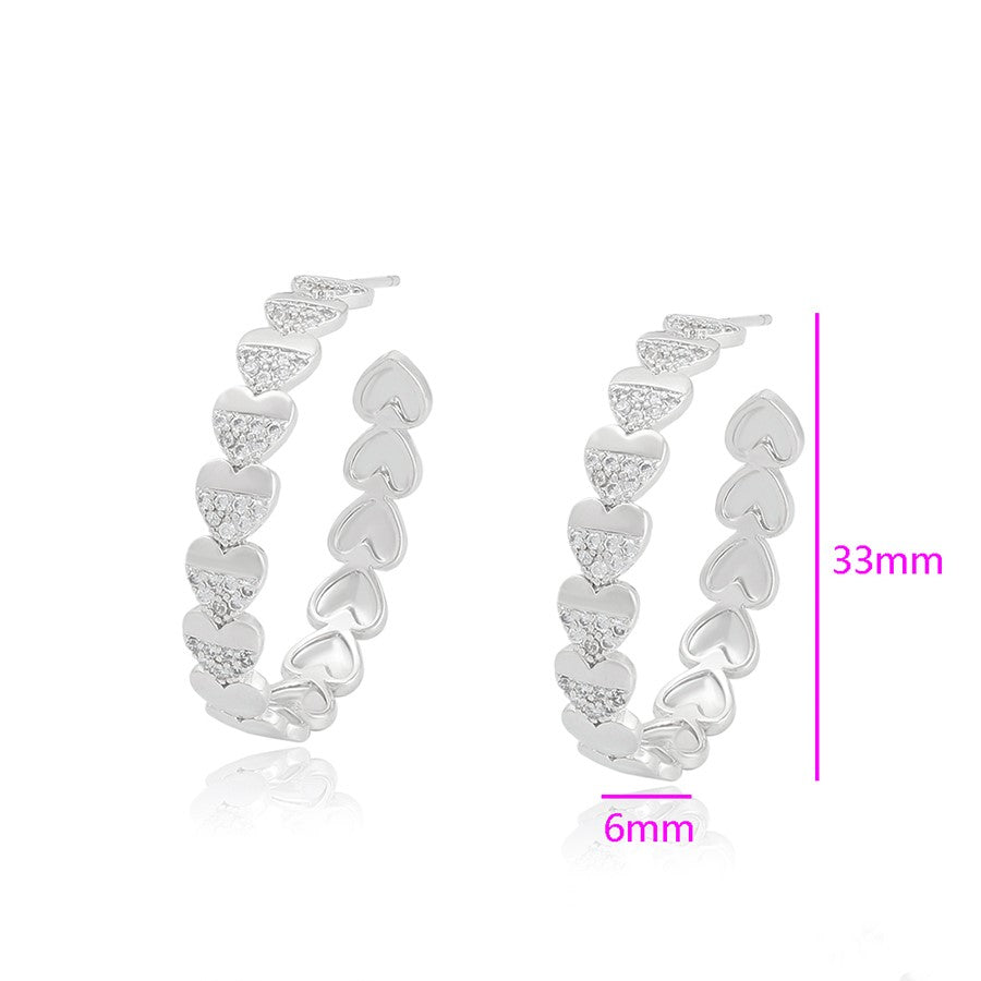 Boucles d'oreilles créoles coeurs rhodiés