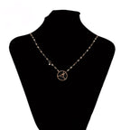 Collar Acero Oro Rosa Con Detalles Negros Elegante